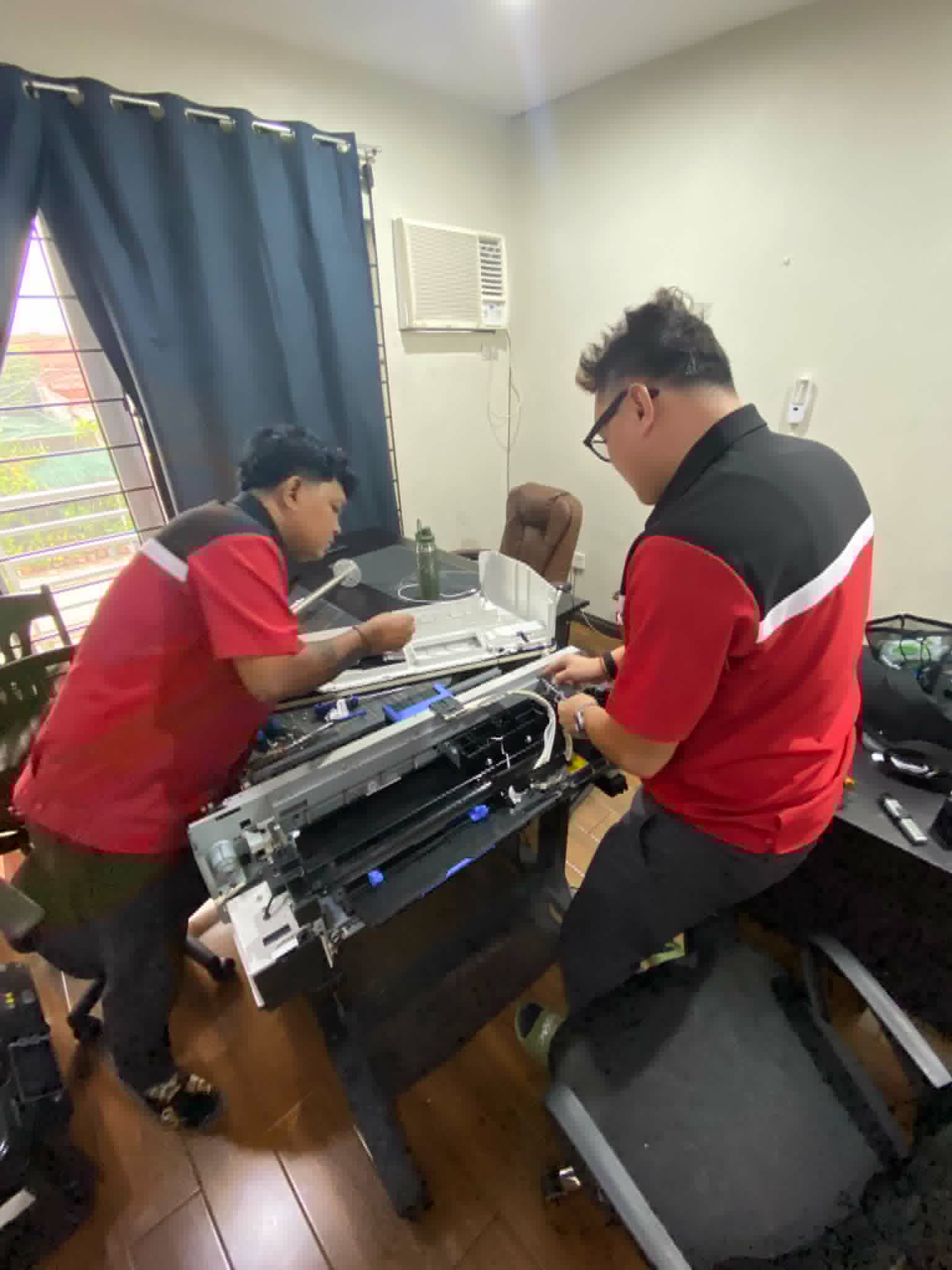 Technician working on printer 1