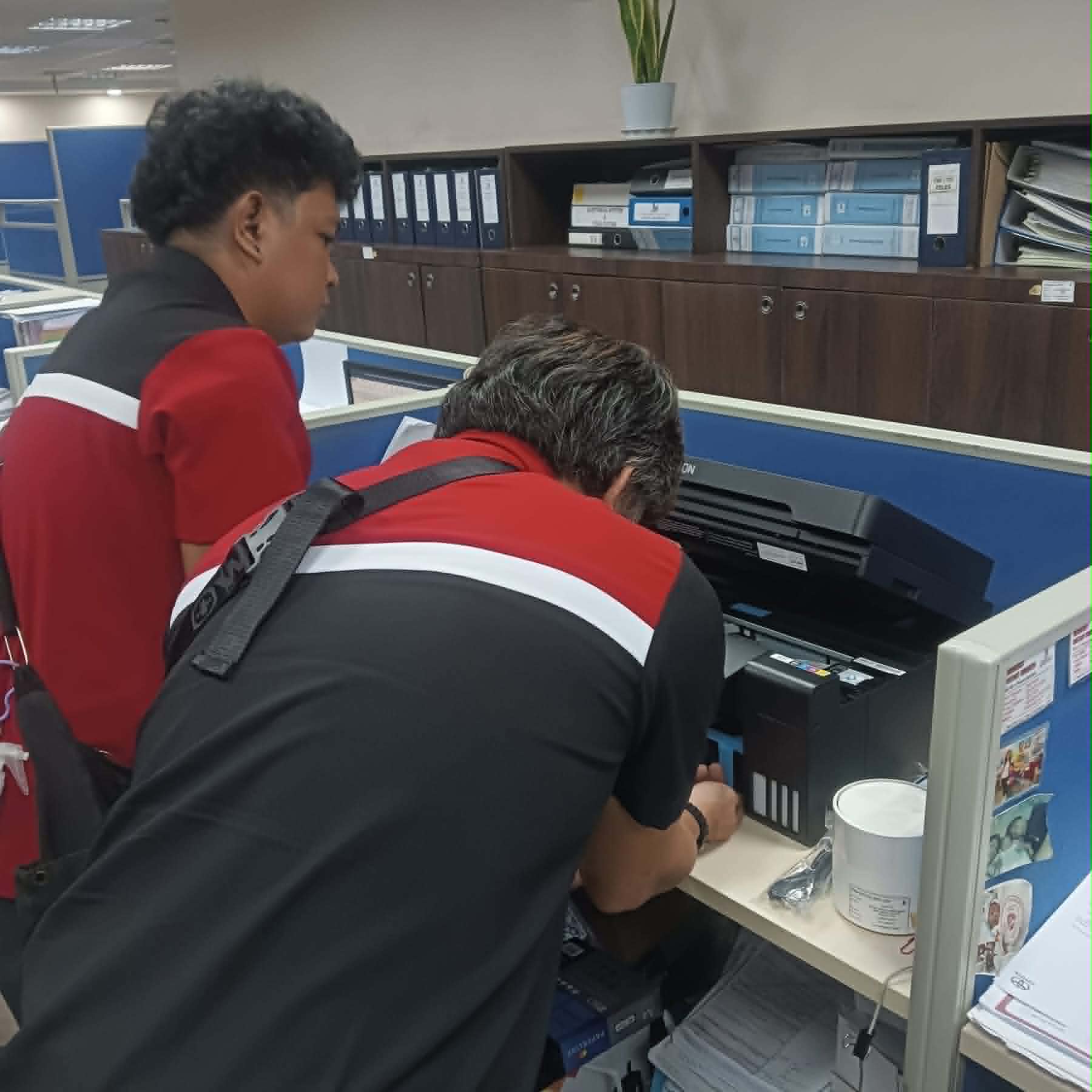 Technician working on printer 4